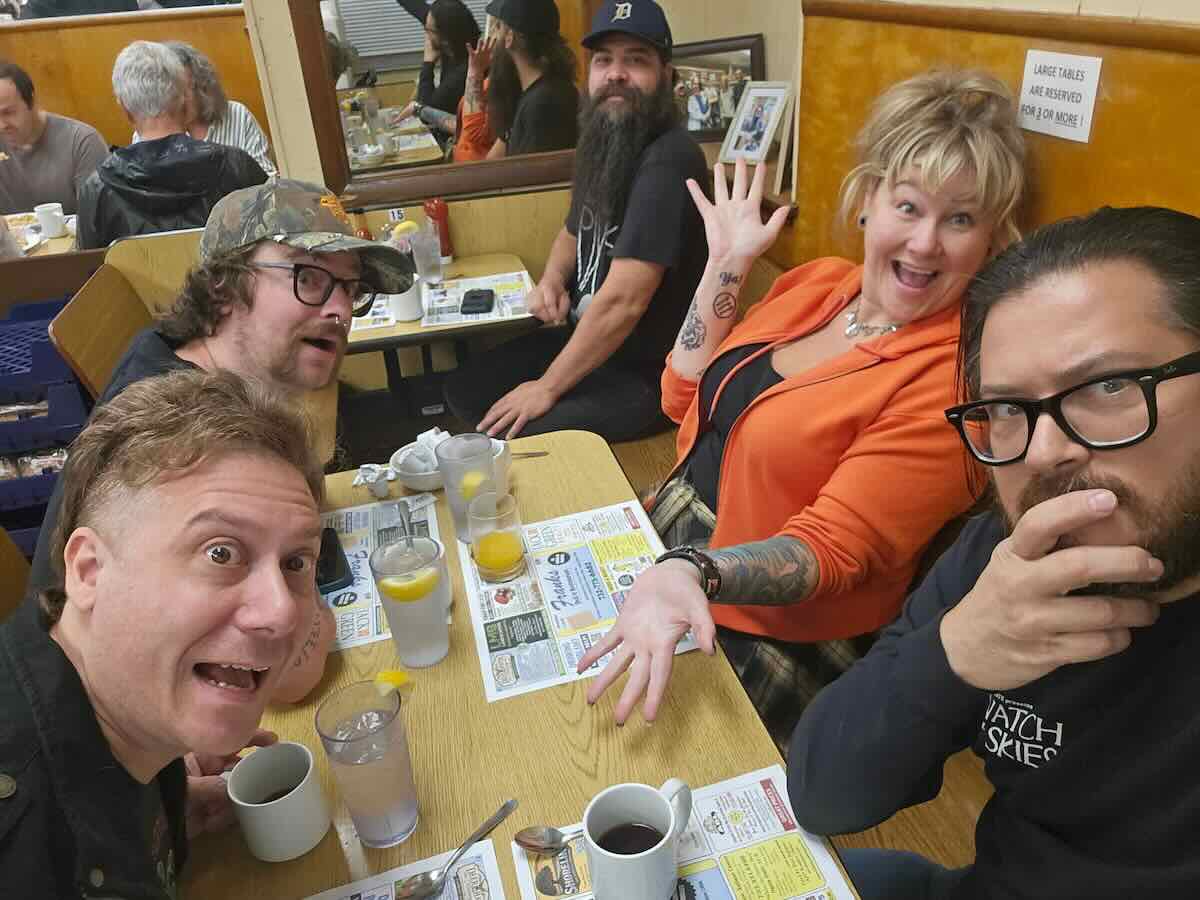 Friends gathered around a table at Frank's Deli